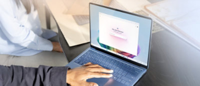 A person typing on a laptop.